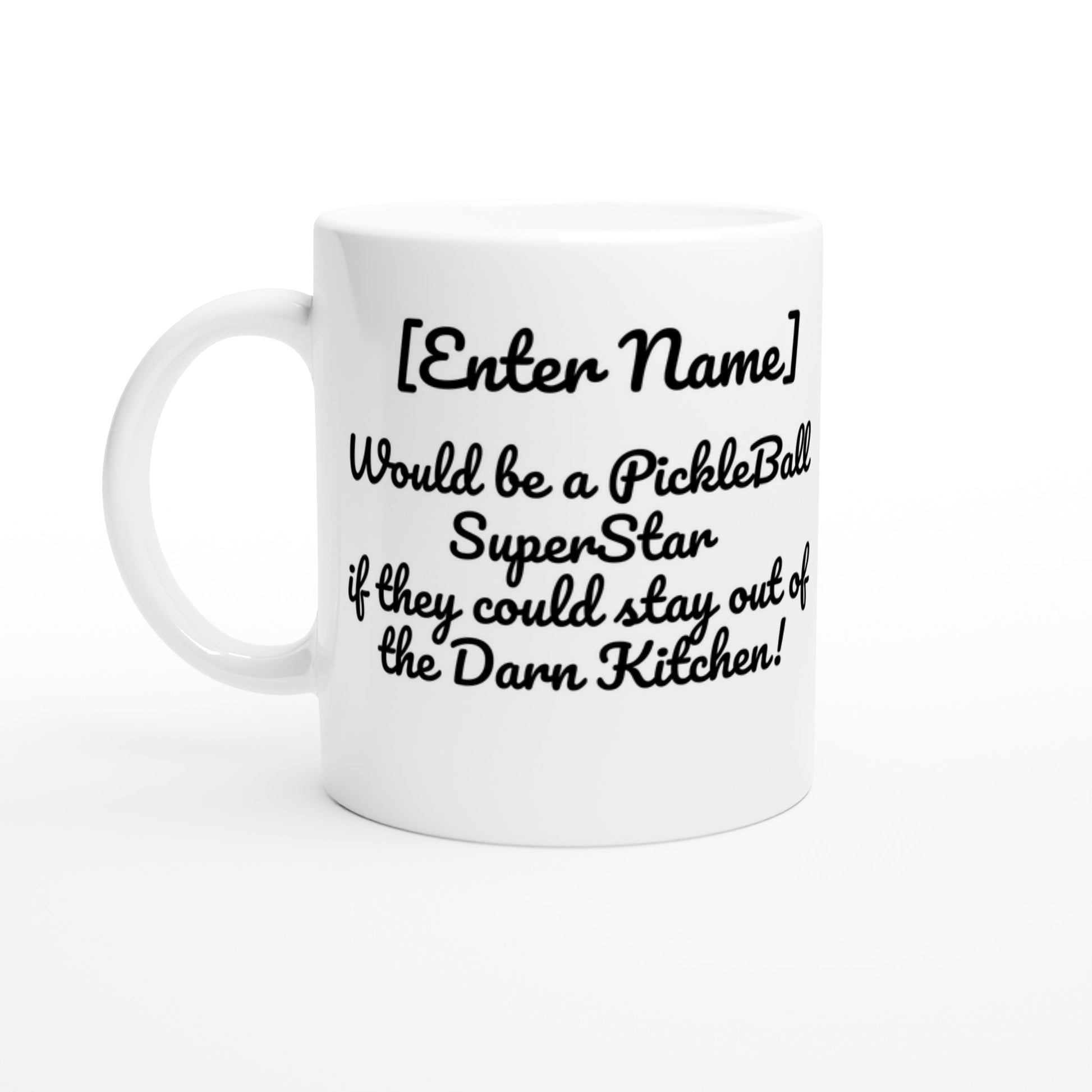 Personalized White ceramic 11oz mug with white handle Personalized with motto  Your Name Would be a PickleBall Superstar if they could stay out of the Darn Kitchen front side Let's Play PickleBall logo on back dishwasher and microwave safe ceramic coffee mug from WhatYa Say Apparel front view.