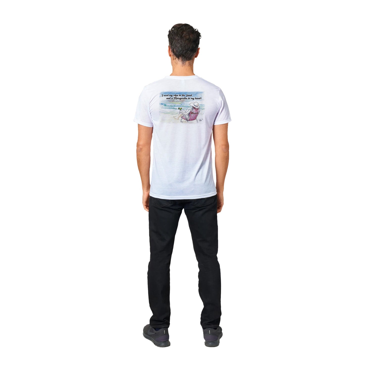 A white Performance Moisture-wicking with PosiCharge Unisex Crewneck t-shirt with original artwork and motto I need my Ass in the Sand and a Margarita in my hand on back of t-shirt and WhatYa Say logo on front from WhatYa Say Apparel a rear view of short dark haired male model.