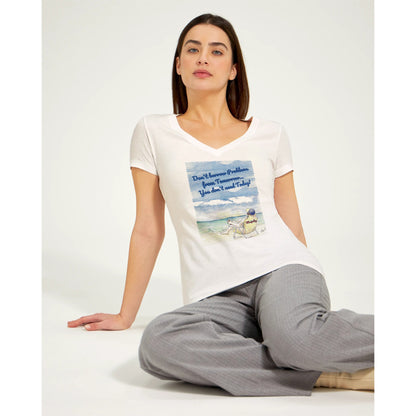 A premium women’s V-neck t-shirt from combed and ring-spun cotton original logo Don’t borrow Problems from Tomorrow… You don’t need Today! on front worn by a dark-haired female model sitting on floor.