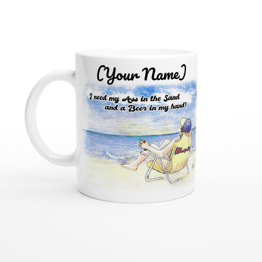Personalized white ceramic 11oz mug with personalized motto [Your Name] I need my Ass in the Sand and a Beer in my hand front side and WhatYa Say logo on back dishwasher and microwave safe ceramic coffee mug from WhatYa Say Apparel front view.