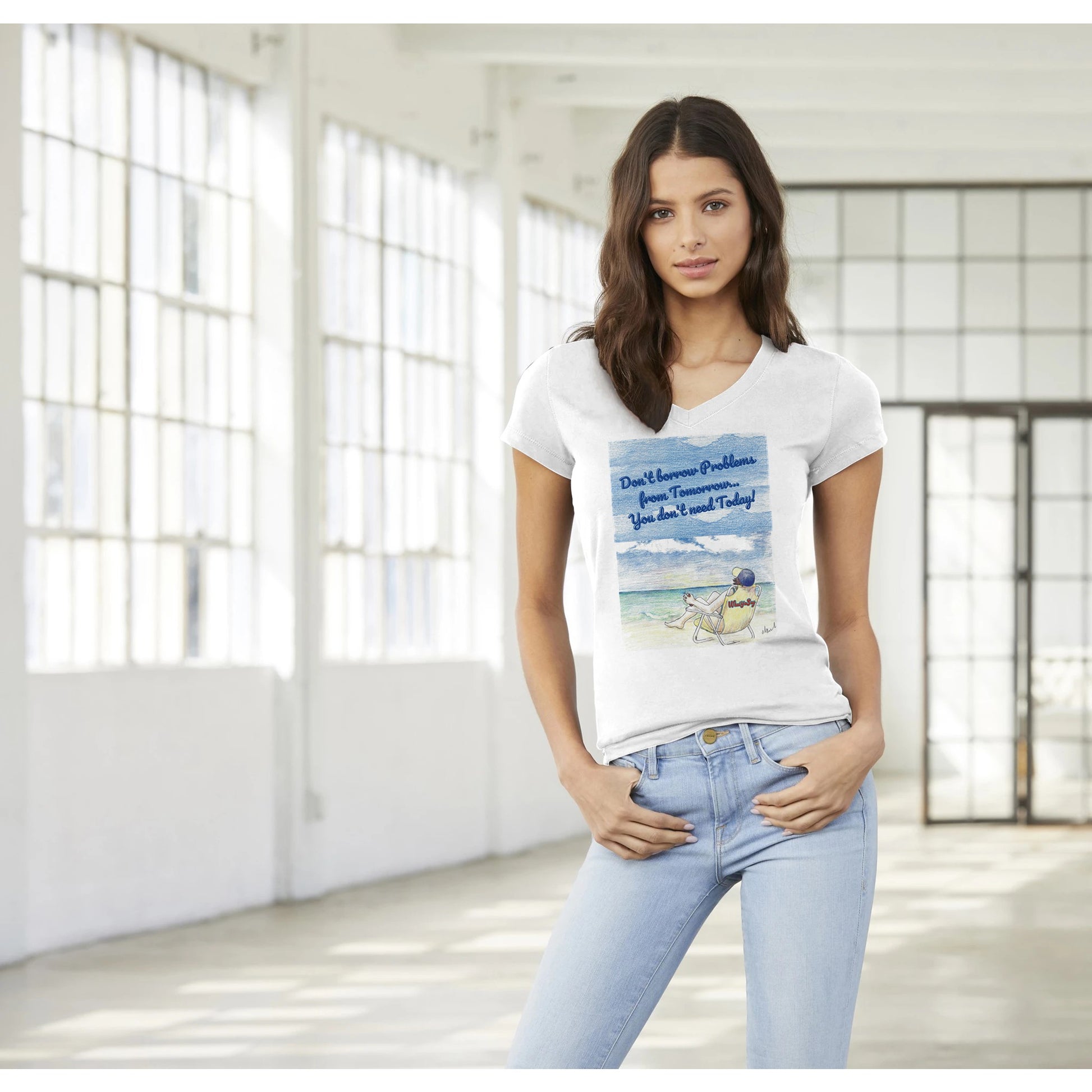 A premium women’s V-neck t-shirt from combed and ring-spun cotton original logo Don’t borrow Problems from Tomorrow… You don’t need Today! on front worn by a dark-haired female model standing with both thumbs in front pockets.
