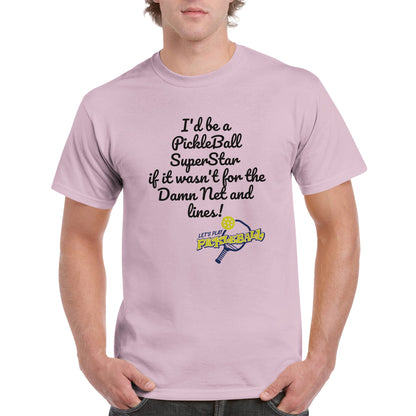 Light Pink comfortable Unisex Crewneck heavyweight cotton t-shirt with funny saying I’d be a PickleBall SuperStar if it wasn’t for the Damn Net and Lines and Let’s Play Pickleball logo on the front from WhatYa Say Apparel worn by blonde-haired male front view.