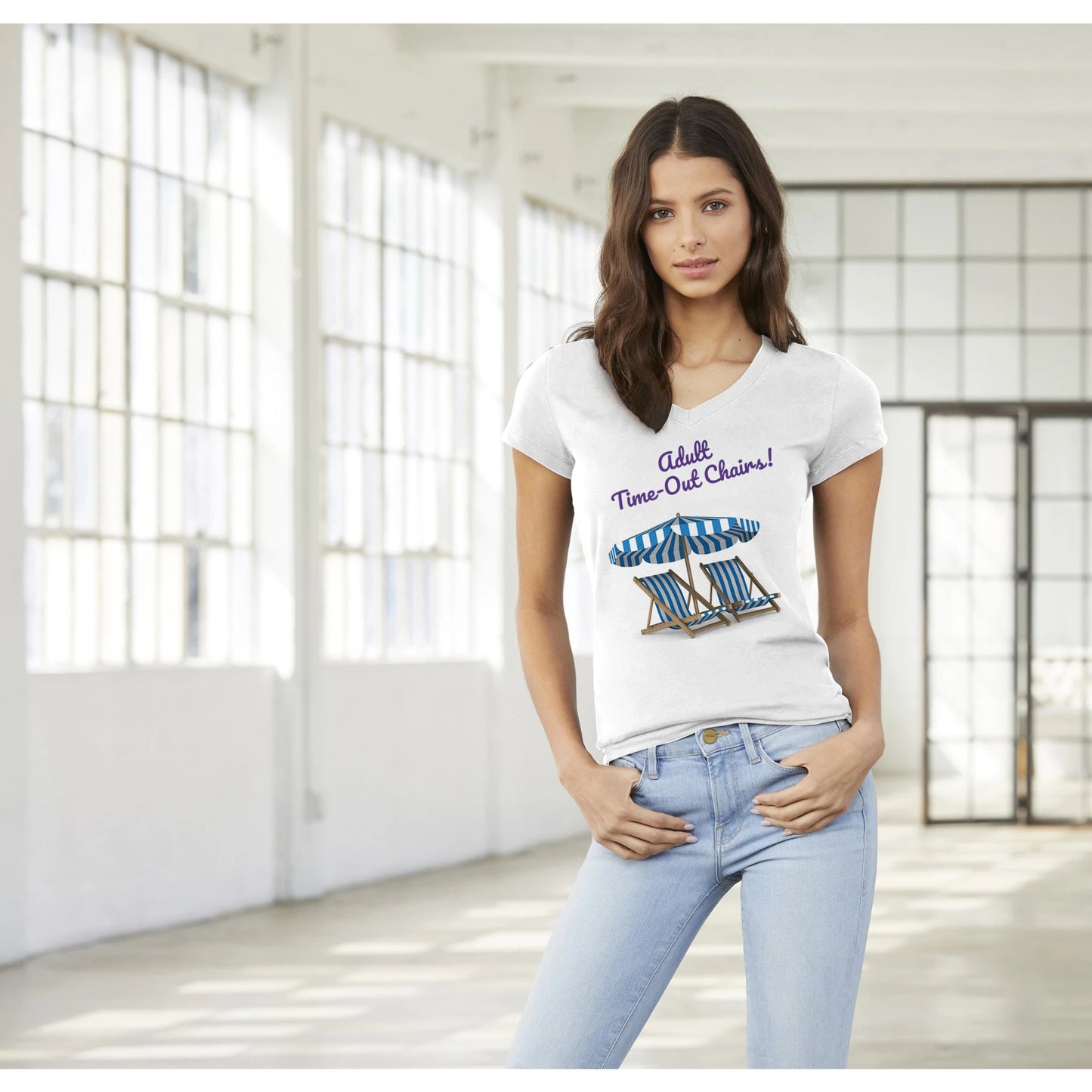 A premium women’s V-neck t-shirt from combed and ring-spun cotton original Adult Time-Out Chairs! on front worn by a dark-haired female model standing with both thumbs in front pockets.