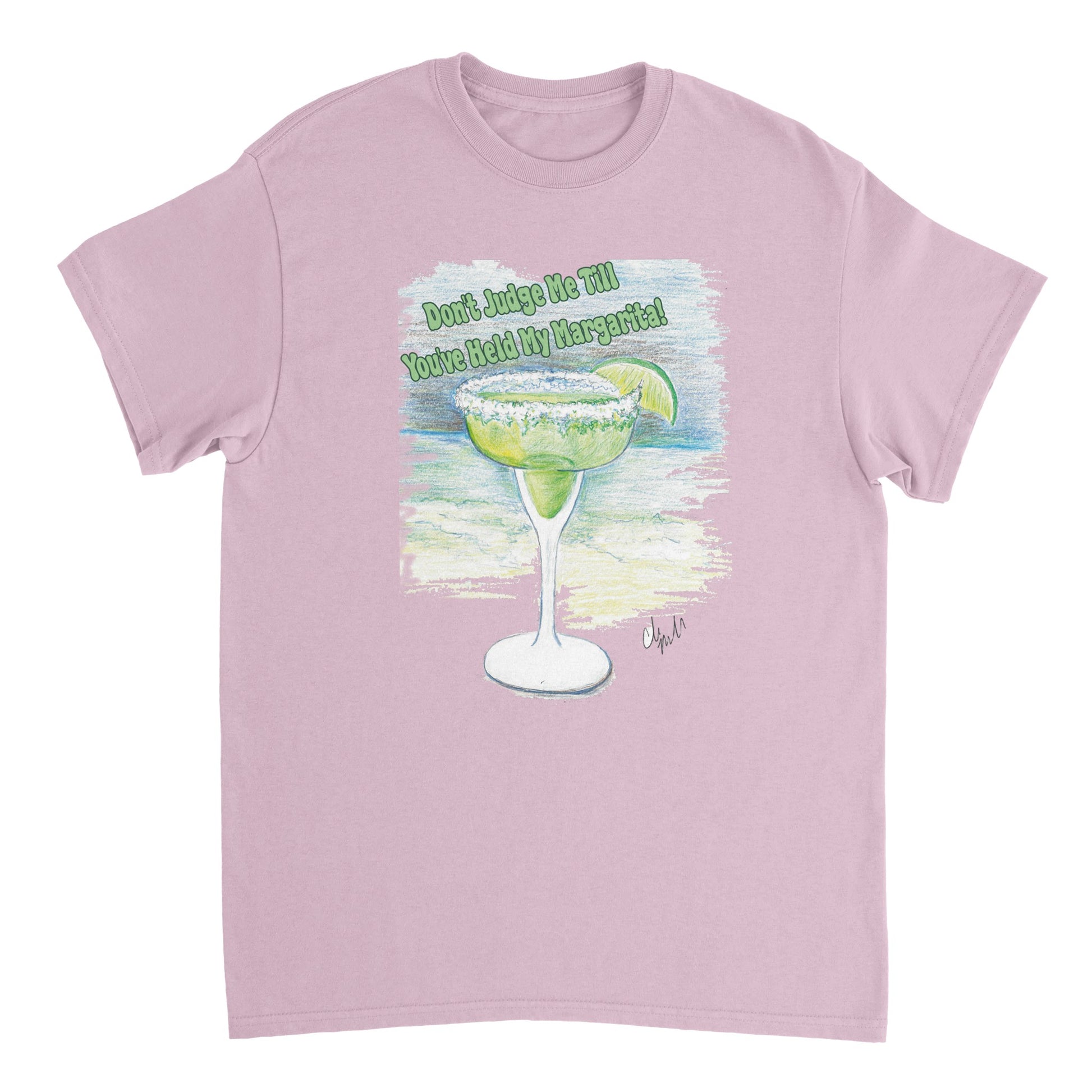 A light pink heavyweight Unisex Crewneck t-shirt with original artwork and motto Don’t Judge Me Till You’ve Held my margarita on front of t-shirt from WhatYa Say Apparel.