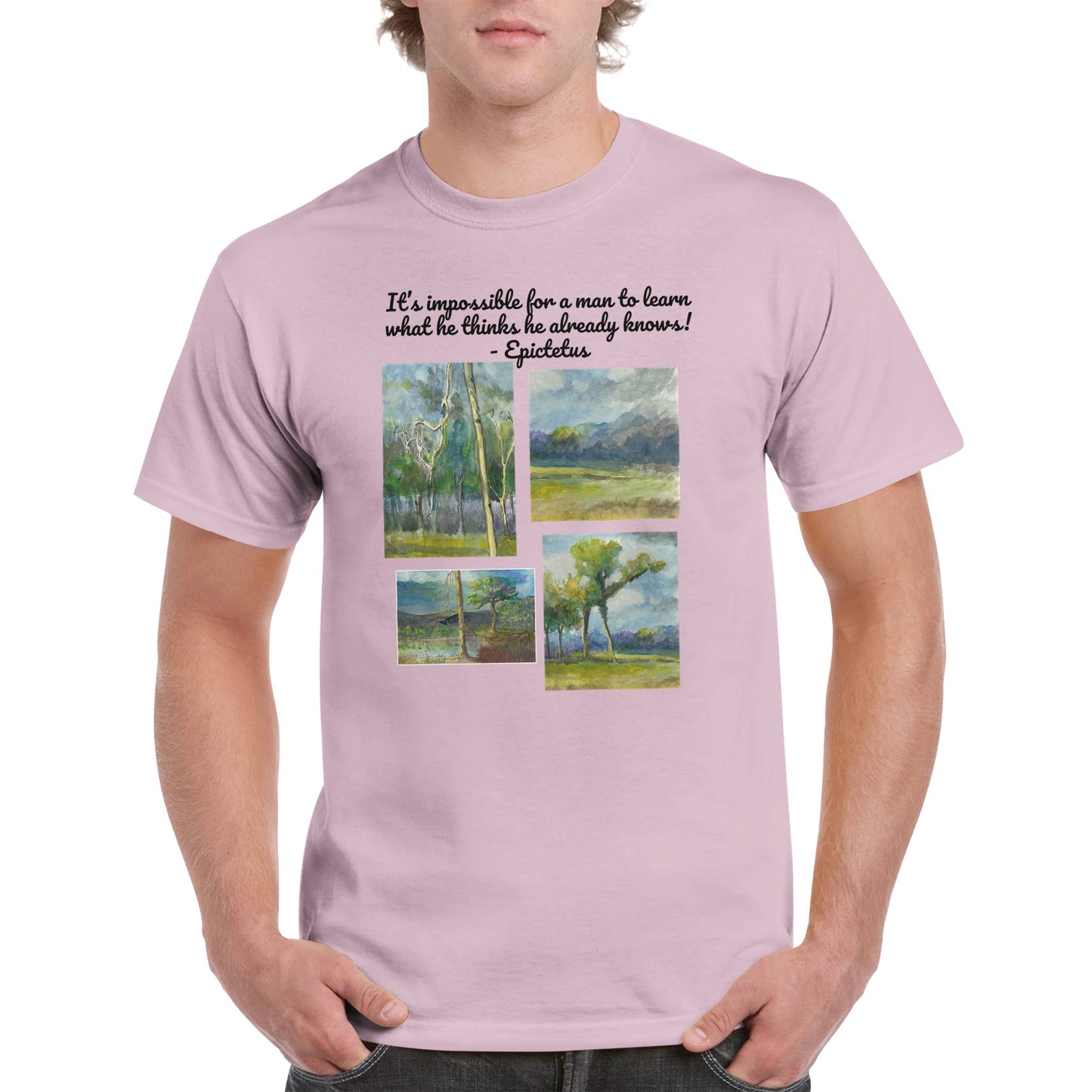 A light pink heavyweight Unisex Crewneck cotton t-shirt with original artwork It’s impossible for a man to learn what he thinks he already knows! on the front from WhatYa Say Apparel worn by blonde-haired male front view.