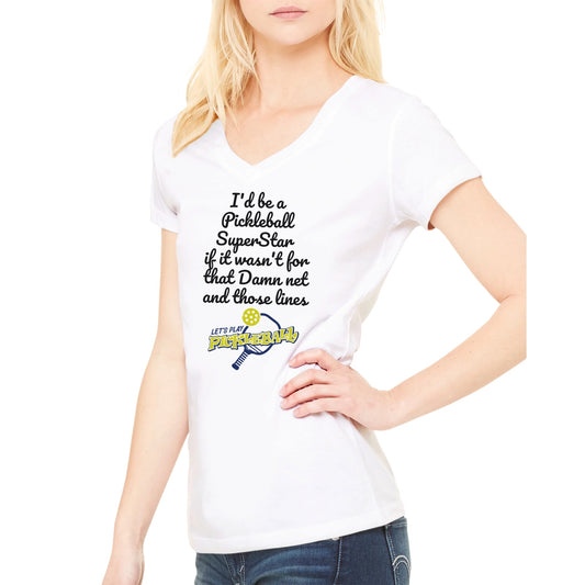 Blonde hair Female model wearing premium women’s V-neck t-shirt with original logo I'd be a PickleBall SuperStar if it wasn't for that Damn net and those lines and Lets Play PIckleball logo on front from WhatYa Say Apparel made from combed and ring-spun cotton.