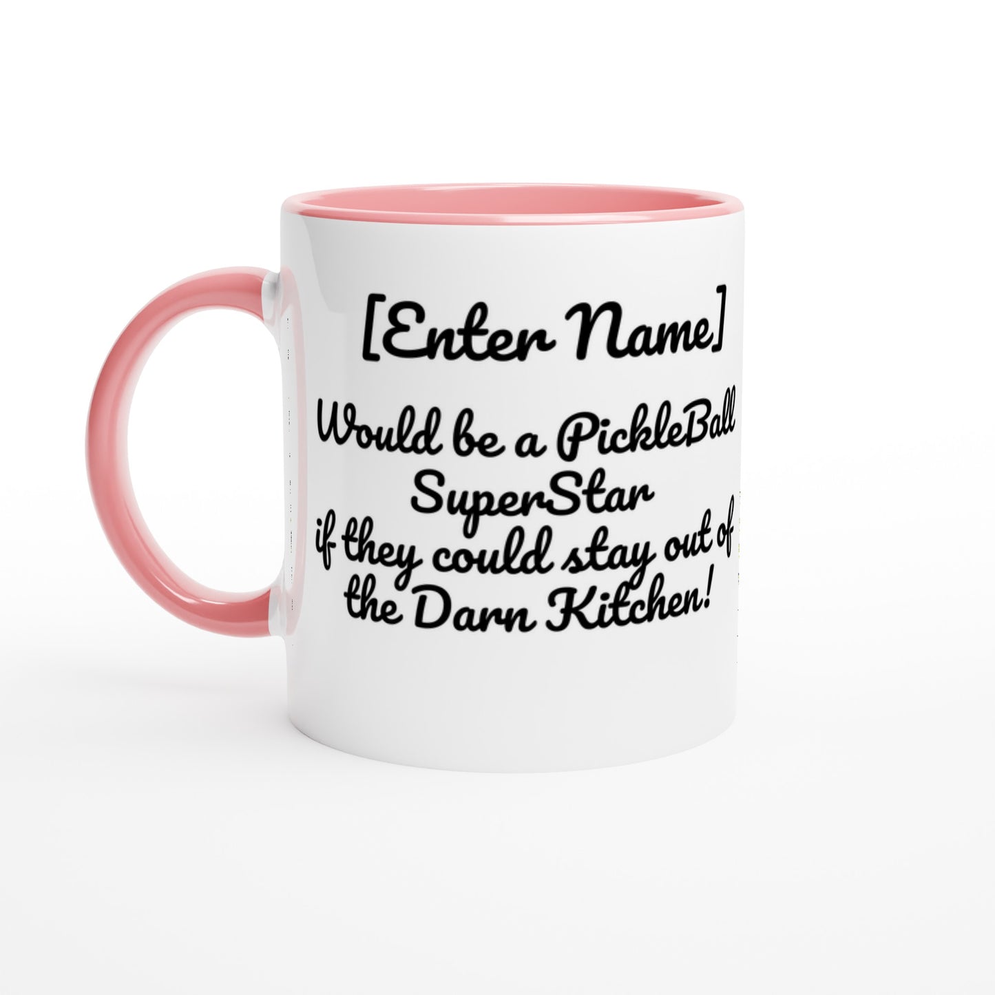 White ceramic 11oz mug with pink handle Personalized with motto Your Name Would be a PickleBall Superstar if they could stay out of the Darn Kitchen front side Let's Play PickleBall logo on back dishwasher and microwave safe ceramic coffee mug from WhatYa Say Apparel front view.