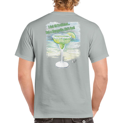 A blonde-haired male wearing a ash heavyweight Unisex Crewneck t-shirt with original artwork and motto I Got 99 Problems But a Margarita Ain't One on back and WhatYa Say logo on front of t-shirt facing backwards from WhatYa Say apparel.