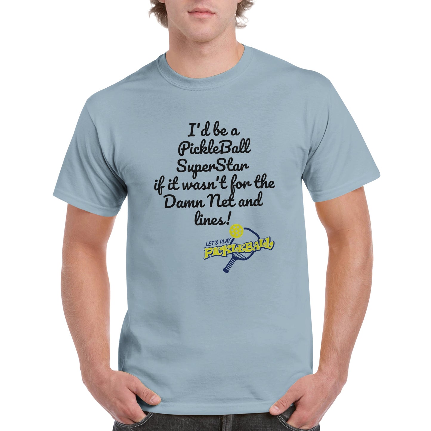 Light blue comfortable Unisex Crewneck heavyweight cotton t-shirt with funny saying I’d be a PickleBall SuperStar if it wasn’t for the Damn Net and Lines and Let’s Play Pickleball logo on the front from WhatYa Say Apparel worn by blonde-haired male front view.