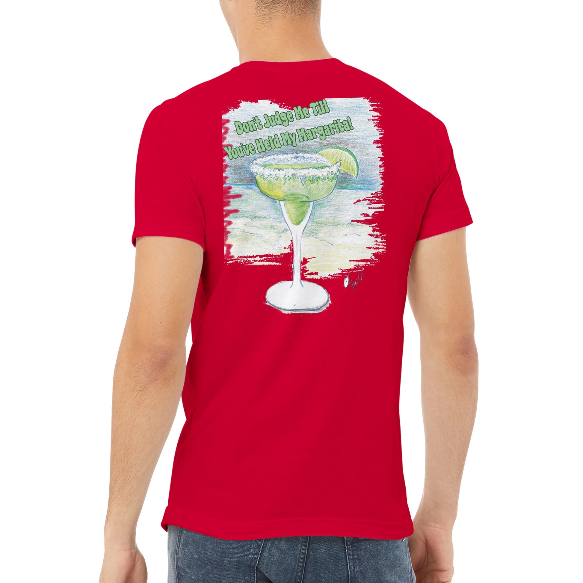 A brown-haired male wearing a WhatYa Say Red premium unisex v-neck t-shirt with original artwork and motto Don’t Judge Me Till You’ve Held My Margarita on back from WhatYa Say Apparel.