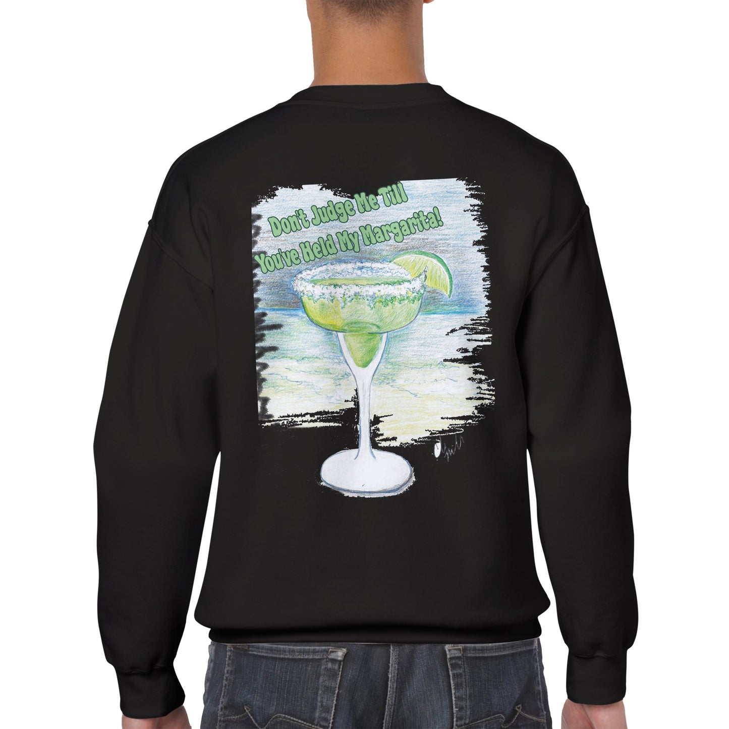 A rear view of short haired male model wearing a black Classic Unisex Crewneck sweatshirt with original artwork and motto Don’t Judge Me Till You’ve Held my margarita on back and Whatya Say logo on front from WhatYa Say Apparel.
