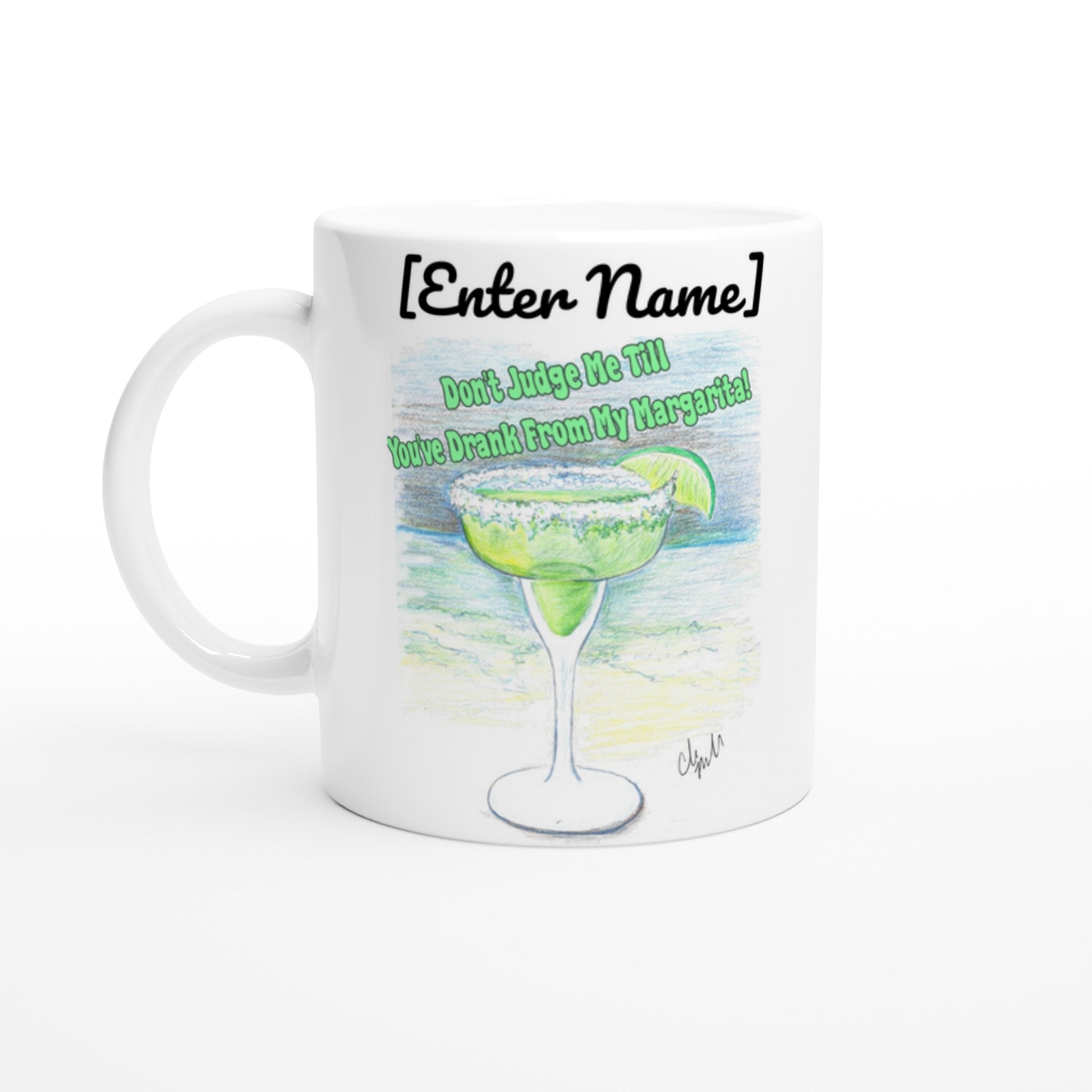 A white pesonalized ceramic 11oz mug with personalized original motto [Your Name Don’t Judge Me Till You’ve Drank From My Margarita on front and WhatYa Say logo on back dishwasher and microwave safe from WhatYa Say Apparel front view.