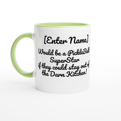 Personalized White ceramic 11oz mug with green handle Personalized with motto Your Name Would be a PickleBall Superstar if they could stay out of the Darn Kitchen front side  Let's Play PickleBall logo on back dishwasher and microwave safe ceramic coffee mug from WhatYa Say Apparel front view.