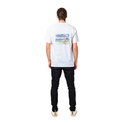 White heavyweight Unisex Crewneck t-shirt with original artwork and motto I need my Ass in the Sand back and WhatYa Say logo on front of t-shirt from WhatYa Say Apparel A rear view of dark-haired male model. standing