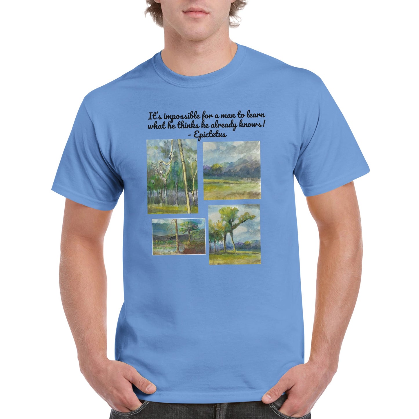 A Carolina Blue heavyweight Unisex Crewneck cotton t-shirt with original artwork It’s impossible for a man to learn what he thinks he already knows! on the front from WhatYa Say Apparel worn by blonde-haired male front view.