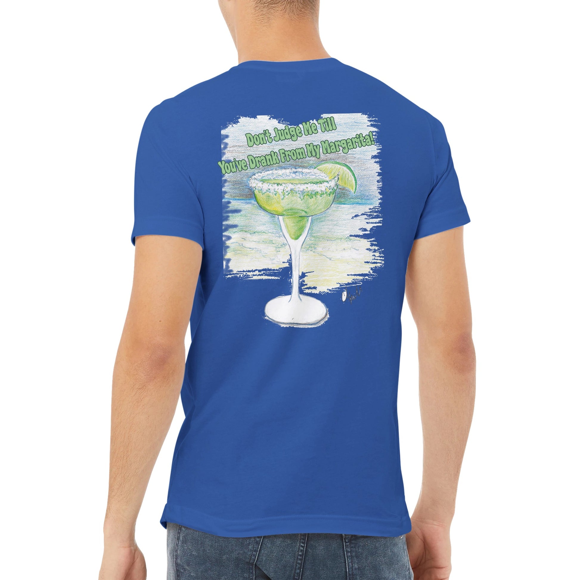 A blue premium Unisex v-neck t-shirt with original artwork and motto Don’t Judge Me Till You’ve Drank from my margarita on back of t-shirt from WhatYa Say Apparel with WhatYa Say logo on front.