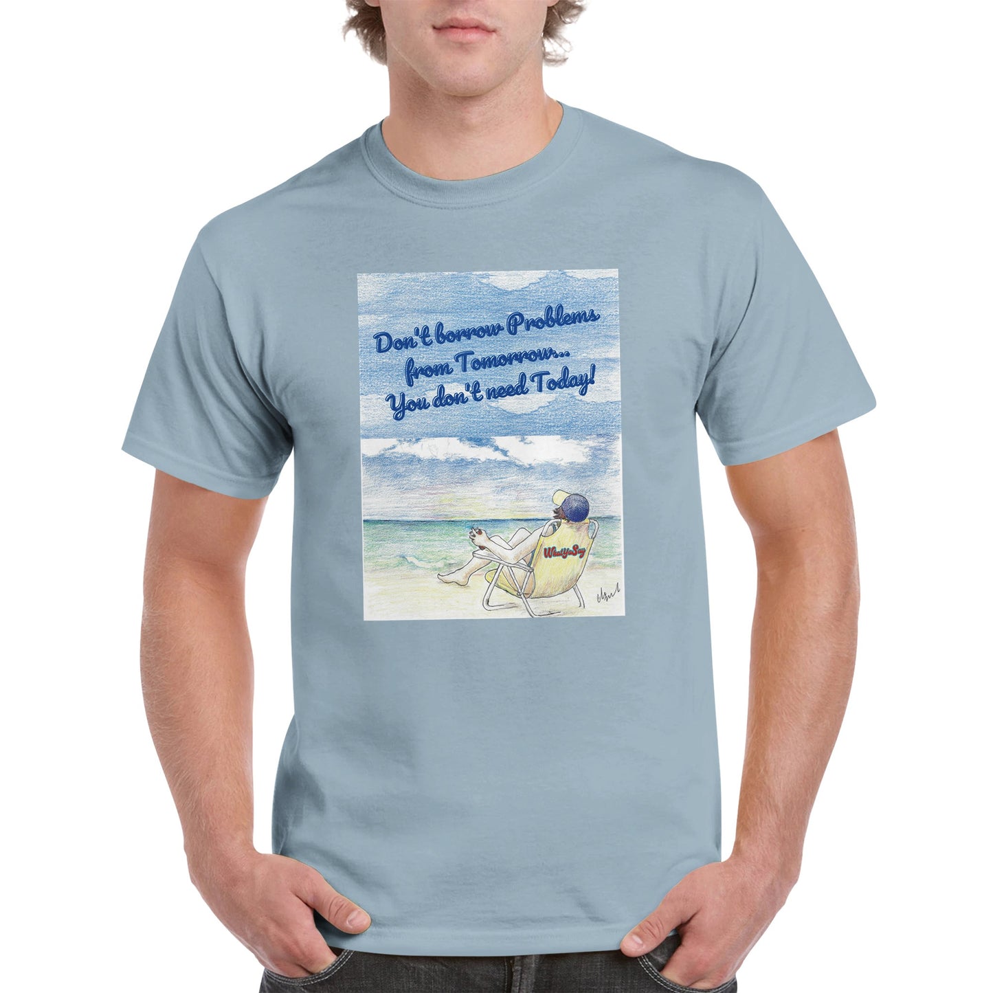 A light blue heavyweight Unisex Crewneck t-shirt with original artwork and motto Don’t borrow Problems from Tomorrow… You don’t need Today! on front with WhatYa Say logo on image from WhatYa Say Apparel worn by blonde-haired male front view.