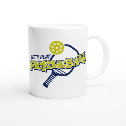 Personalized white ceramic 11oz mug with Logo Let's Play PIckleball  on back and motto Personalized Your Name Would be a PickleBall Superstar if they could stay out of the Darn Kitchen coffee mug dishwasher and microwave safe from WhatYa Say Apparel back view.