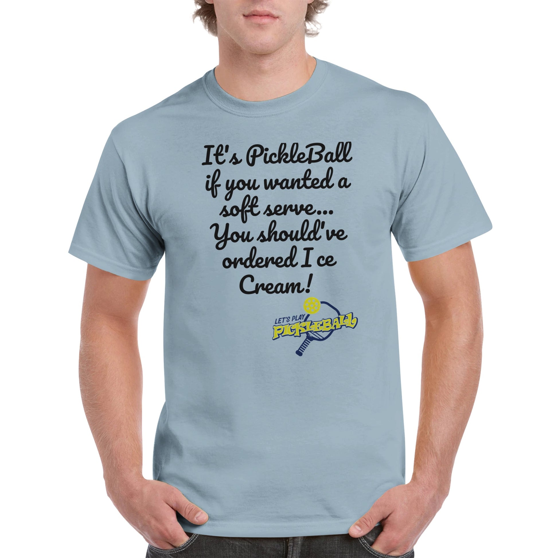 Light Blue comfortable Unisex Crewneck heavyweight cotton t-shirt with funny saying It’s PickleBall if you wanted a soft serve… You should’ve ordered Ice Cream! and Let’s Play Pickleball logo on the front from WhatYa Say Apparel worn by blonde-haired male front view.