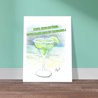 Don't Judge Me Until You've Drank From My Margarita Premium Matt Poster on 80 lb paper leaning on light green wall with neutral wood flooring.