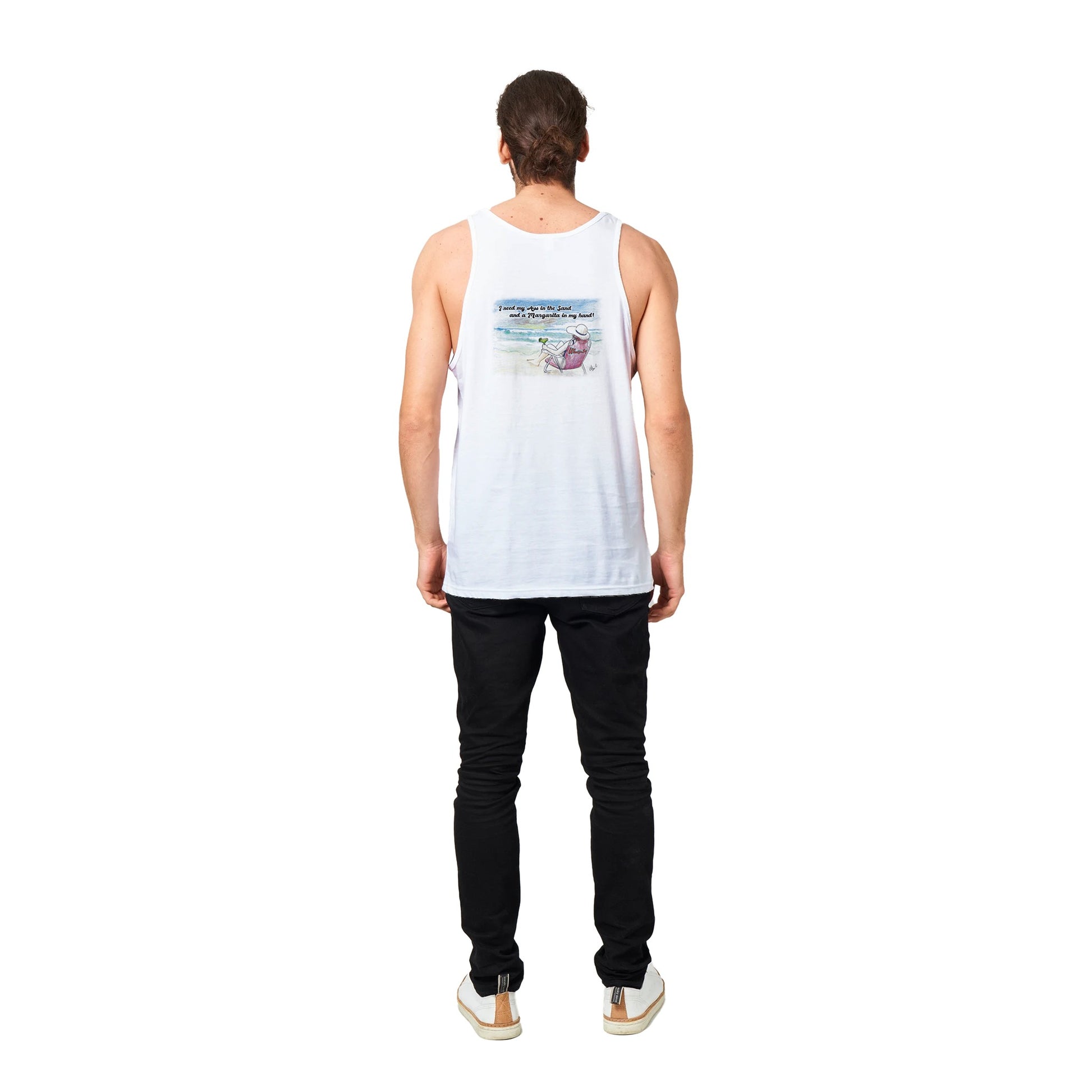 A white Premium Unisex Tank Top with original artwork and motto I need my Ass in the Sand and a Margarita in my hand on back with WhatYa Say Logo on front from combed and ring-spun cotton from WhatYa Say Apparel a brown-haired male model standing  rear view.