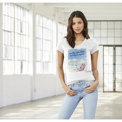 A premium women’s V-neck t-shirt from combed and ring-spun cotton original logo Too Blessed to Bitch… So I’ll just complain! on front worn by a dark-haired female model standing with both thumbs in front pockets.